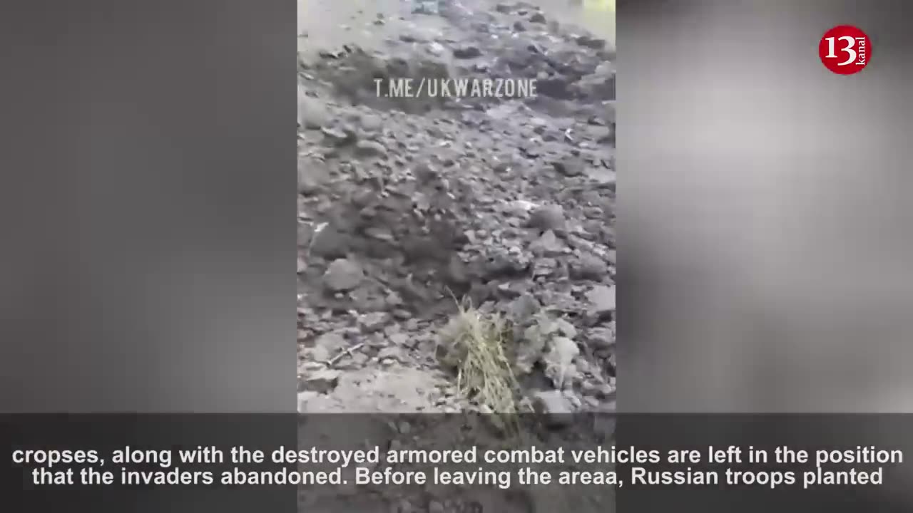 Ukrainian fighters show the equipment and soldiers which they destroyed during the counter-attack