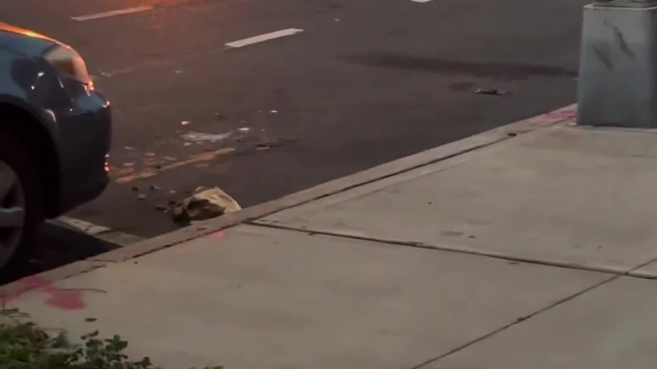 NYPD officers pulled a man out of a crashed vehicle that was on fire in