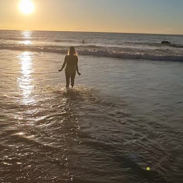 Walking into the sunset at sea big Island Hawaii