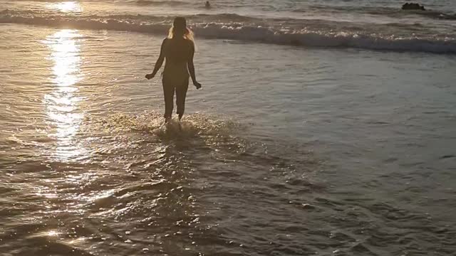 Walking into the sunset at sea big Island Hawaii