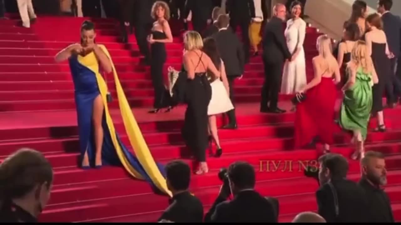 Cannes Protester in Ukrainian Colors Covers Herself with Fake Blood on Red Carpet