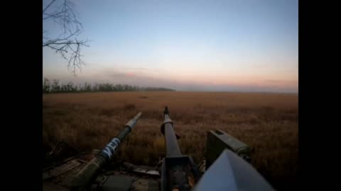 A Ukrainian T-80BV tank from a close range fires at the landing with Russian soldiers