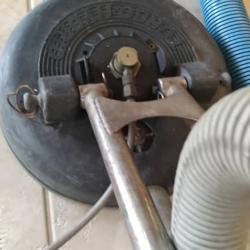 Shayna demonstrating tile and grout cleaning