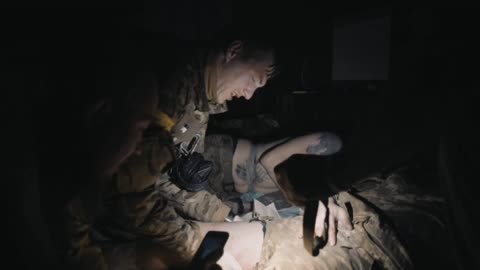 Medics treat members from one of the newer Azov SSO units