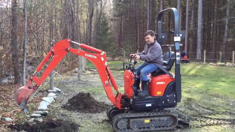 Jims Excavator #43 - Daniel installing a fence post.