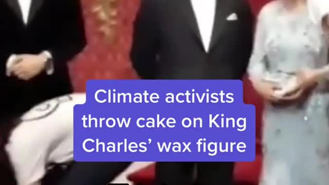 Climate activists throw cake on King Charles' wax figure