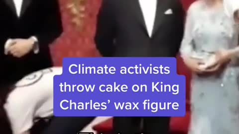 Climate activists throw cake on King Charles' wax figure