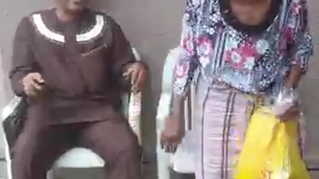 African old Mother exhibiting joyful moves when her son returned home