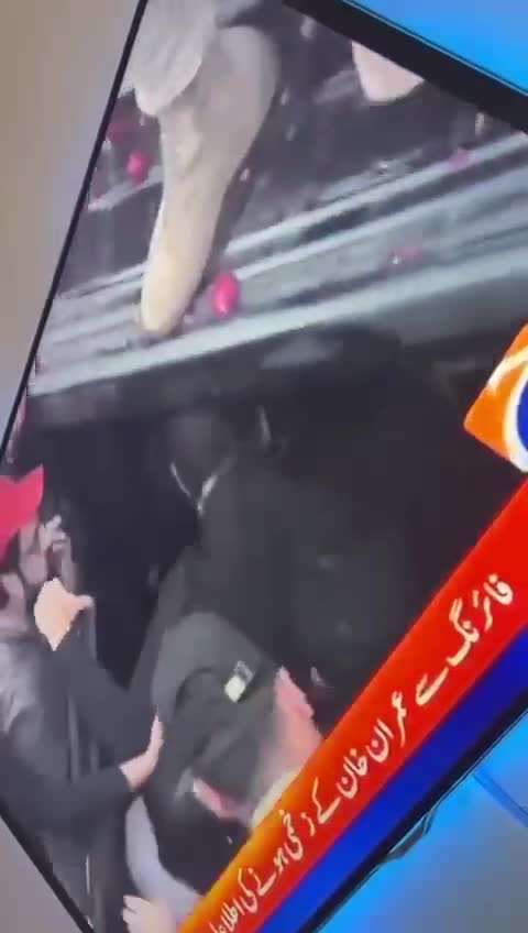 Imran Khan with a bandage on his leg after taking a bullet