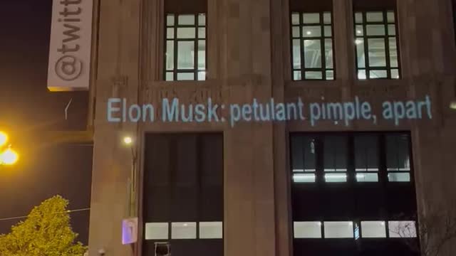 USA. Activist projects messages to Elon Musk at Twitter HQ tonight in San Francisco.