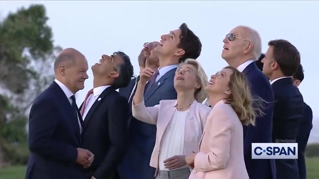 Italian Prime Minister Giorgia Meloni was seen grabbing Biden to bring him back to the group