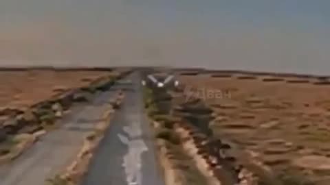 A Russian fighter on a car dodges a Ukrainian FPV drone at the last moment.