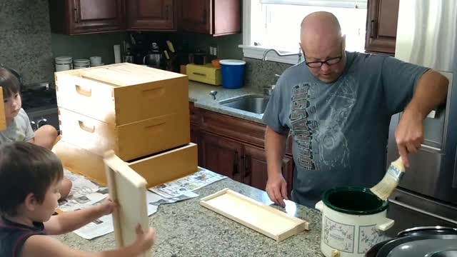 BRUSHING WAX ON FOUNDATION FOR BEES