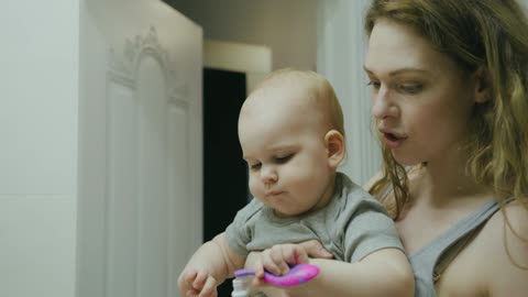 "Toothpaste Fun with Mom and Baby - Adorable Parenthood Moments!"