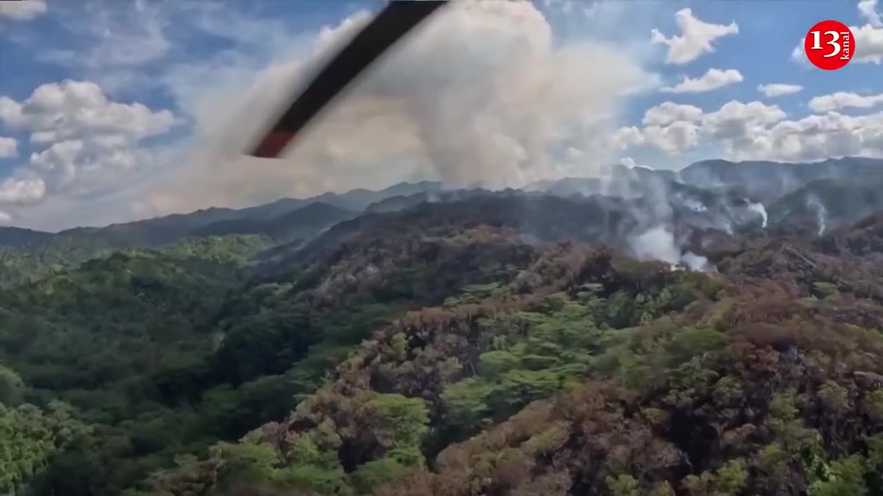 Wildfire in mountainous Oahu, Hawaii moves away from towns