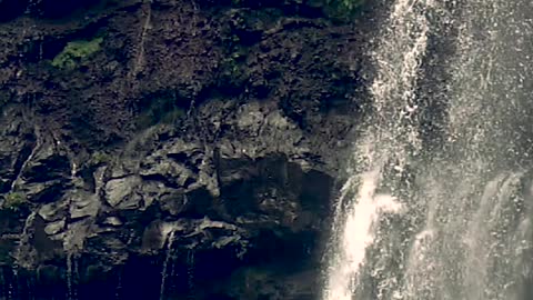 Man Jumping off Waterfalls