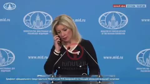 Maria Zakharova, spokeswoman for Russia's foreign ministry, takes phone call during press conference