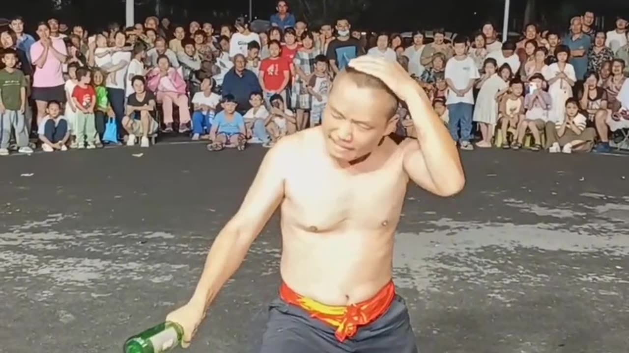 Chinese man breaking bottles