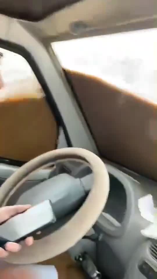 Man Stuck in the car after heavy rain flooded on roads.