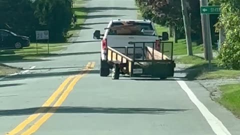 Pickup Tows Precarious Trailer