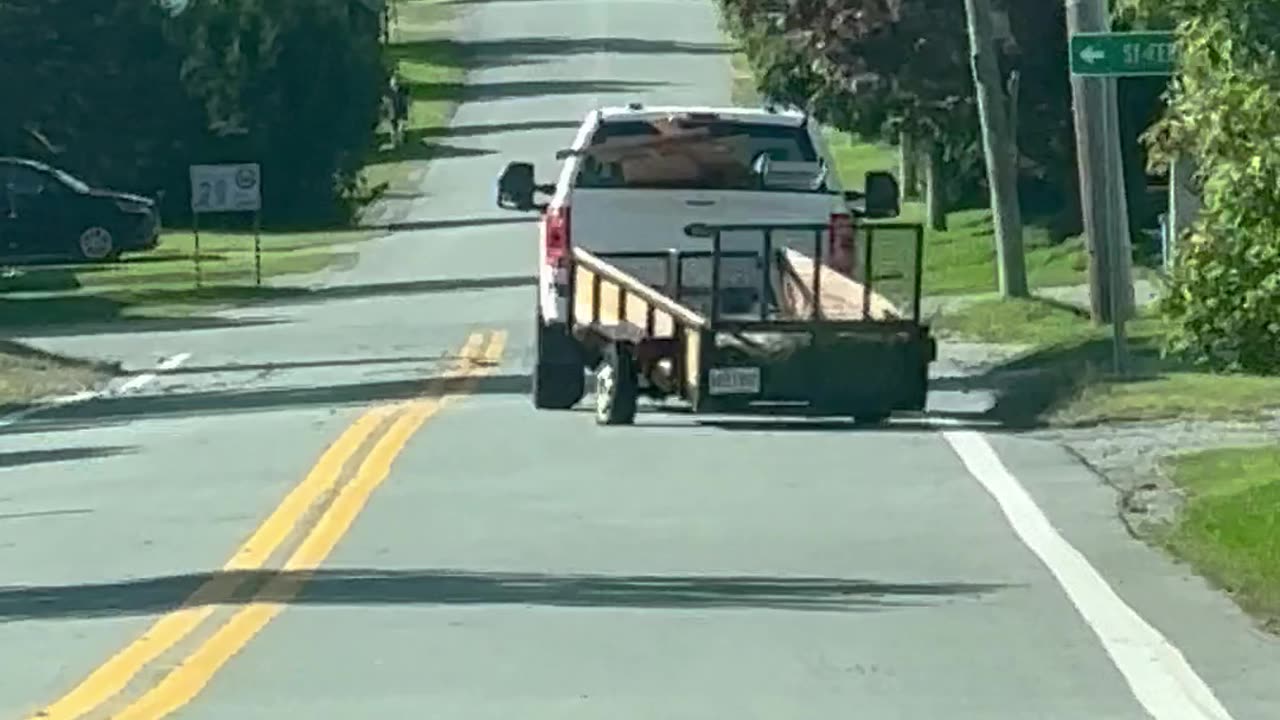 Pickup Tows Precarious Trailer