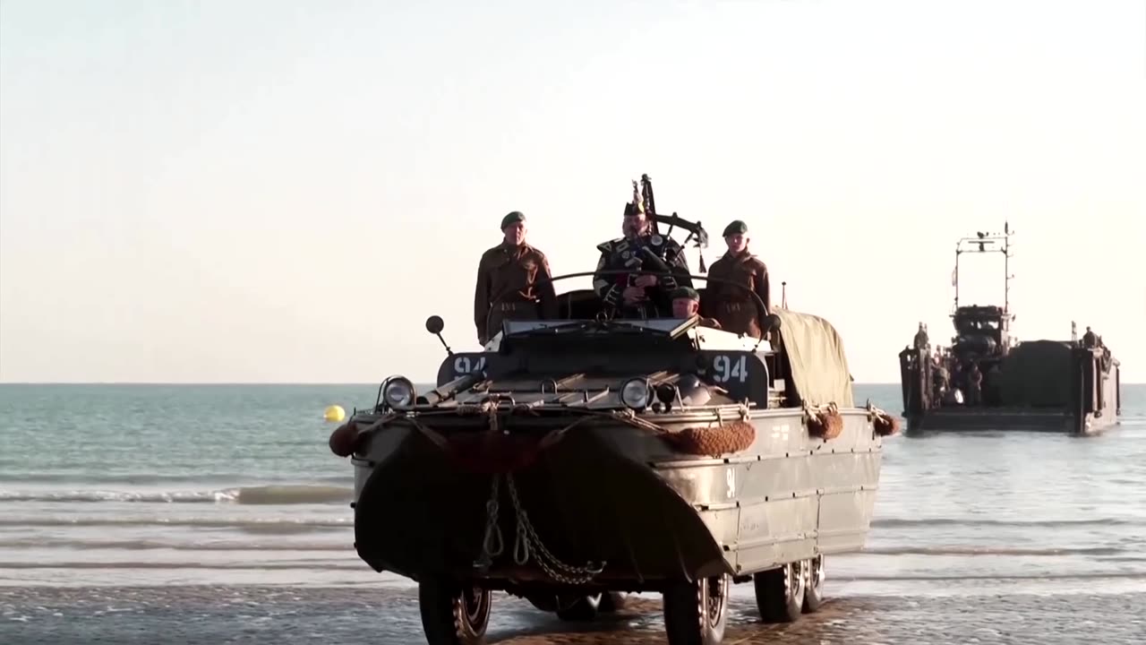 Piper on military vehicle re-enacts D-Day landing