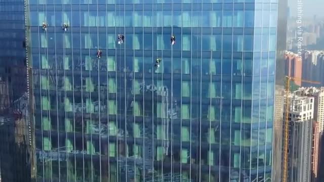 Window Washers Work on a 92-Floor Skyscraper