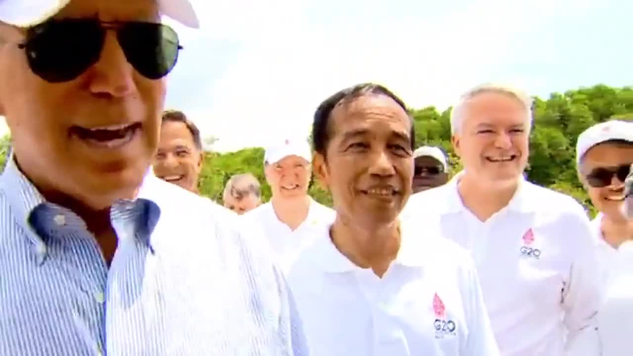 Biden Praises Russian Man's Biceps In Extremely Weird Moment