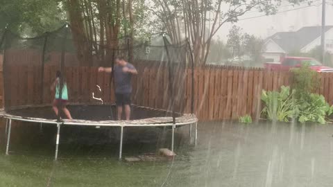 Family Turns Flooded Backyard into Canoe Fun