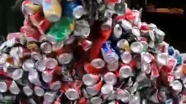 Person Covered With Empty Cans Runs on Streets of Belgian City