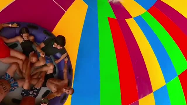 Sliding down The Abyss oscillating raft water slide!