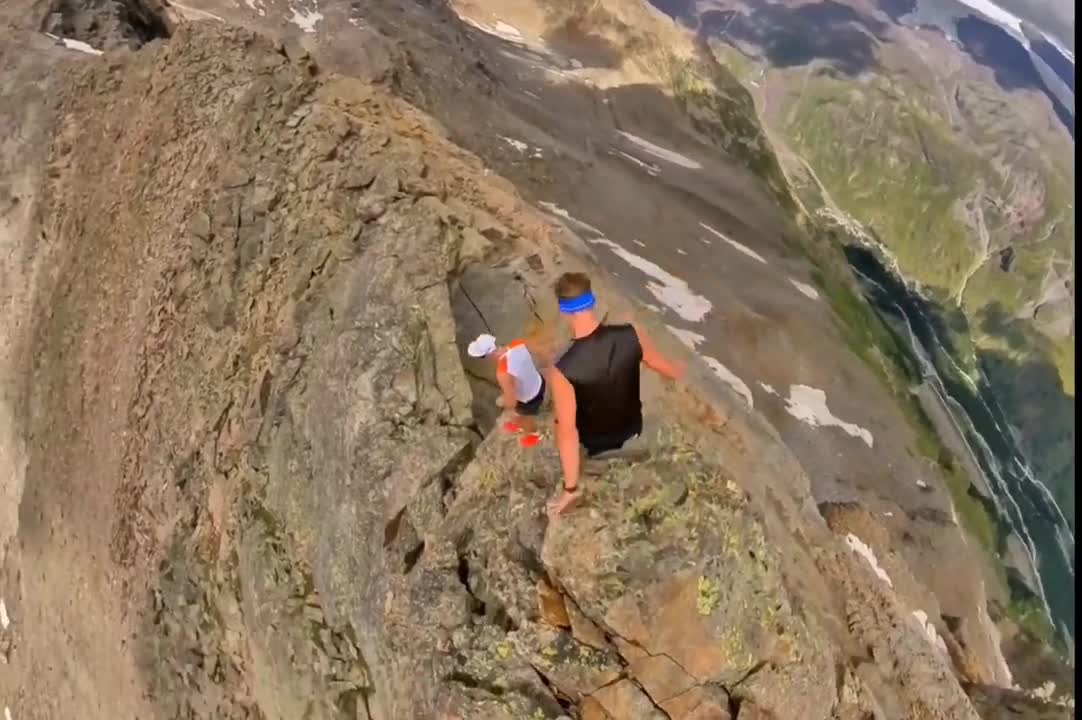 3 Guys Training Together Jogging on Top of a Mountain Route