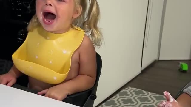 Funny babies are loudly laughing