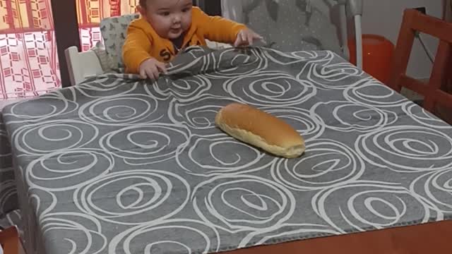 Toddler Pulls Table Cloth to Get Loaf of Bread