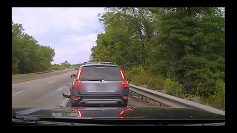 Tesla rashes into a car on the hard shoulder.