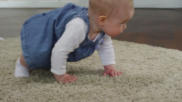 Cute little girl crawling on the floor