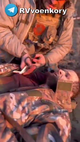 A SERIOUSLY WOUNDED ARMED FORCES OF UKRAINE SOLDIER SCREAMS - A FRAGMENT HAS PIERCED HIS LUNG