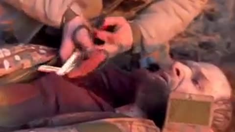 A SERIOUSLY WOUNDED ARMED FORCES OF UKRAINE SOLDIER SCREAMS - A FRAGMENT HAS PIERCED HIS LUNG