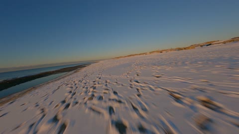 Cinematic FPV - Flying Over Frozen Coast, 4k Ultra HD