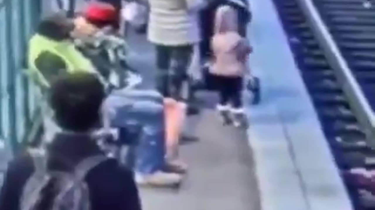 Man Pushes Child Onto Train Tracks