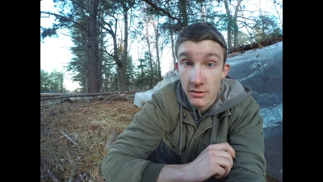 Repairing the roof of my hut