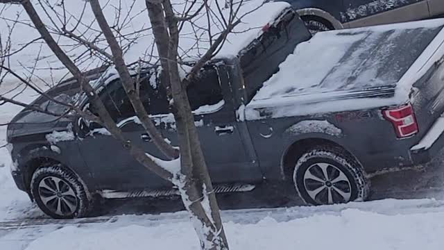 Stuck Truck Finally Freed From Snow