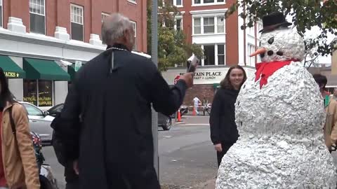 The snowman seems to like the little sister better