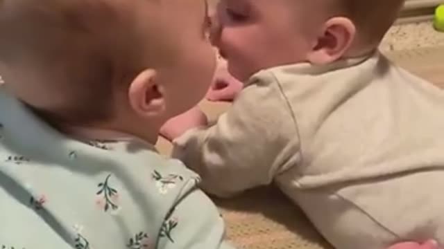 Two baby Sisters keeping each other company