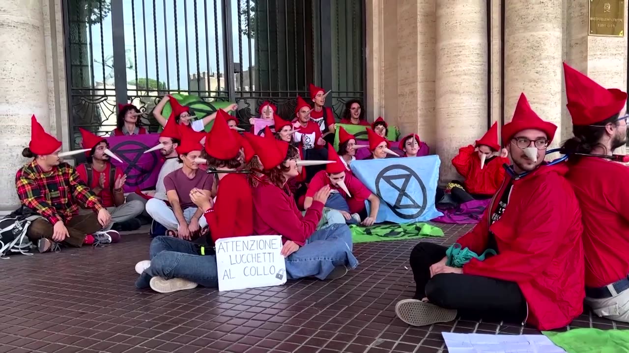 Climate activists dressed as Pinocchio stage protest in Rome