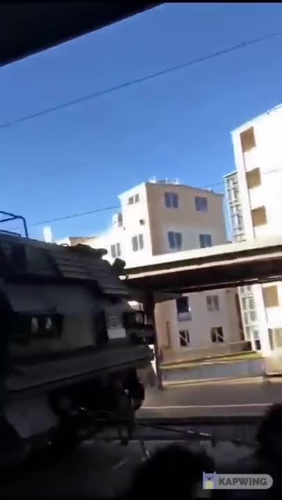German PzH 2000 howitzers and M270 MLRS standing somewhere in an European railway station