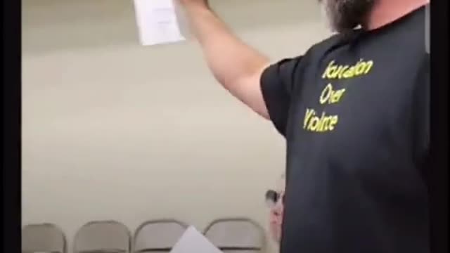 Guy asks questions at school board meeting
