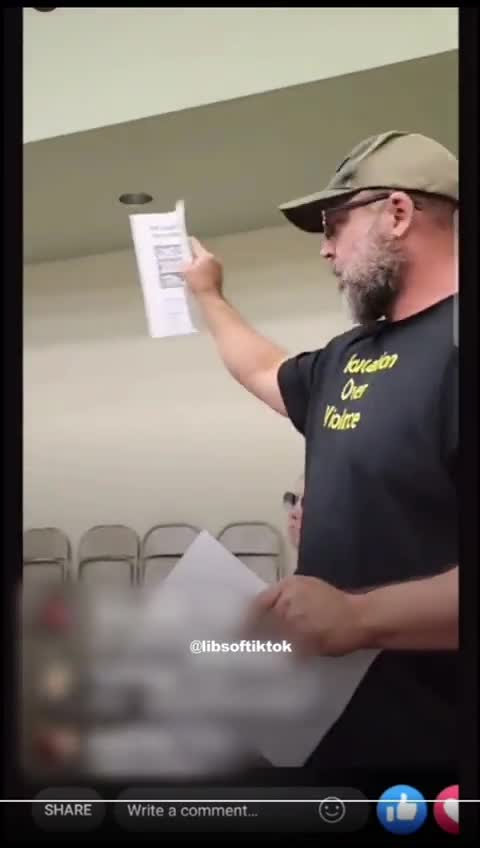 Guy asks questions at school board meeting