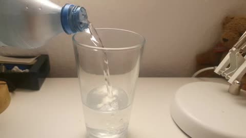 Pouring Water In A Glas