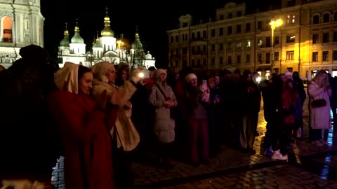 Christmas tree sparkles in dark Kyiv